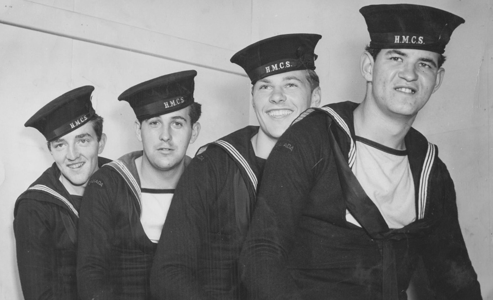 Four survivors from the sinking of the HMCS Regina (K-234)