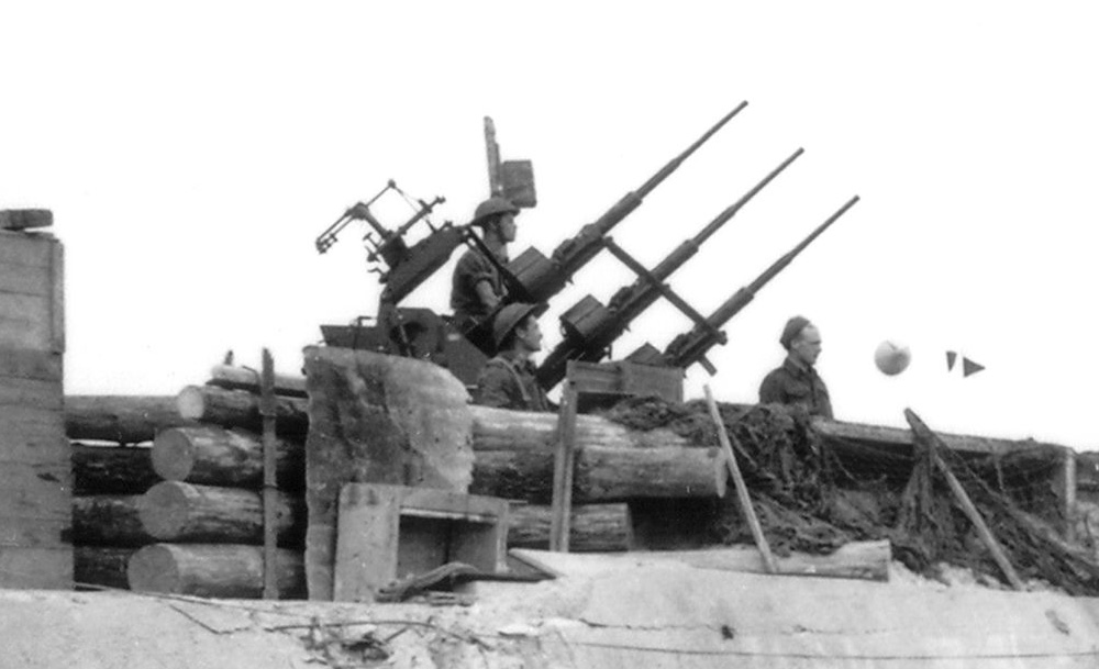 Canadian Polsten 20-mm Oerlikon anti-aircraft guns set up on top of this captured 8.8 cm PaK 43 gun bunker, type R669, on Juno beach in Normandy, June 1944.